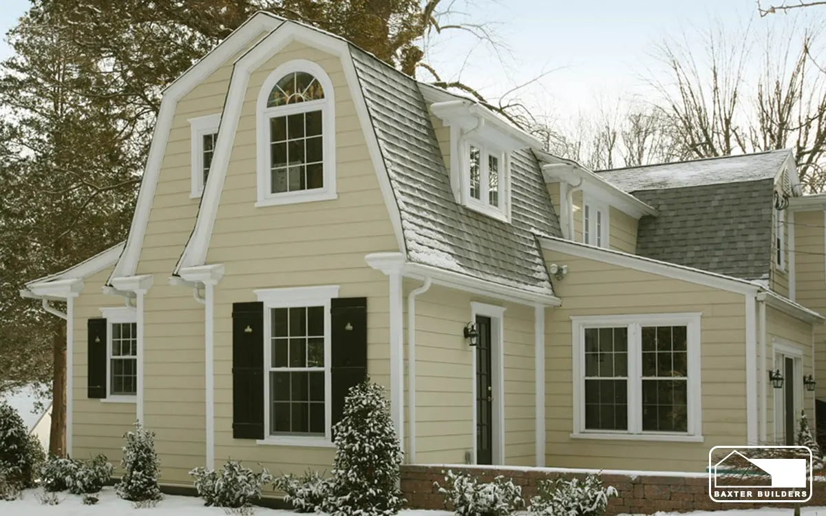 Dutch colonial home with a gambrel-roof addition and new siding