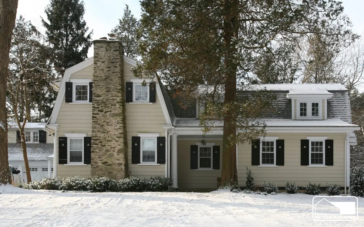 Renovated colonial with a stone chimney and new dormers