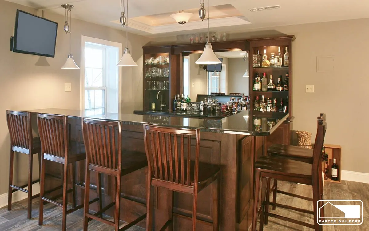 Basement bar and dining area with tray ceiling