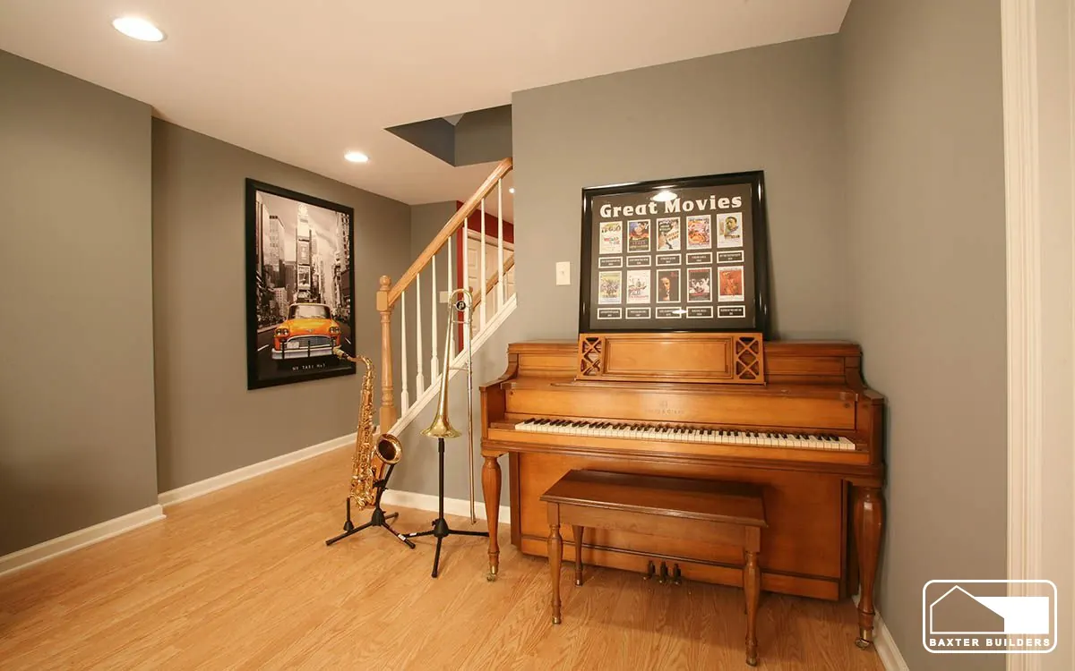 Basement music room with piano and staircase