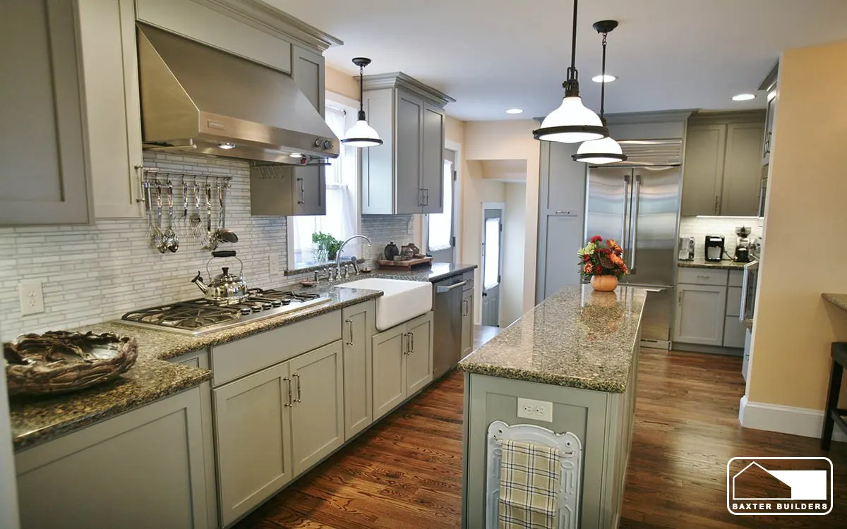 Galley kitchen with farmhouse sink, subway tile and pendant lights