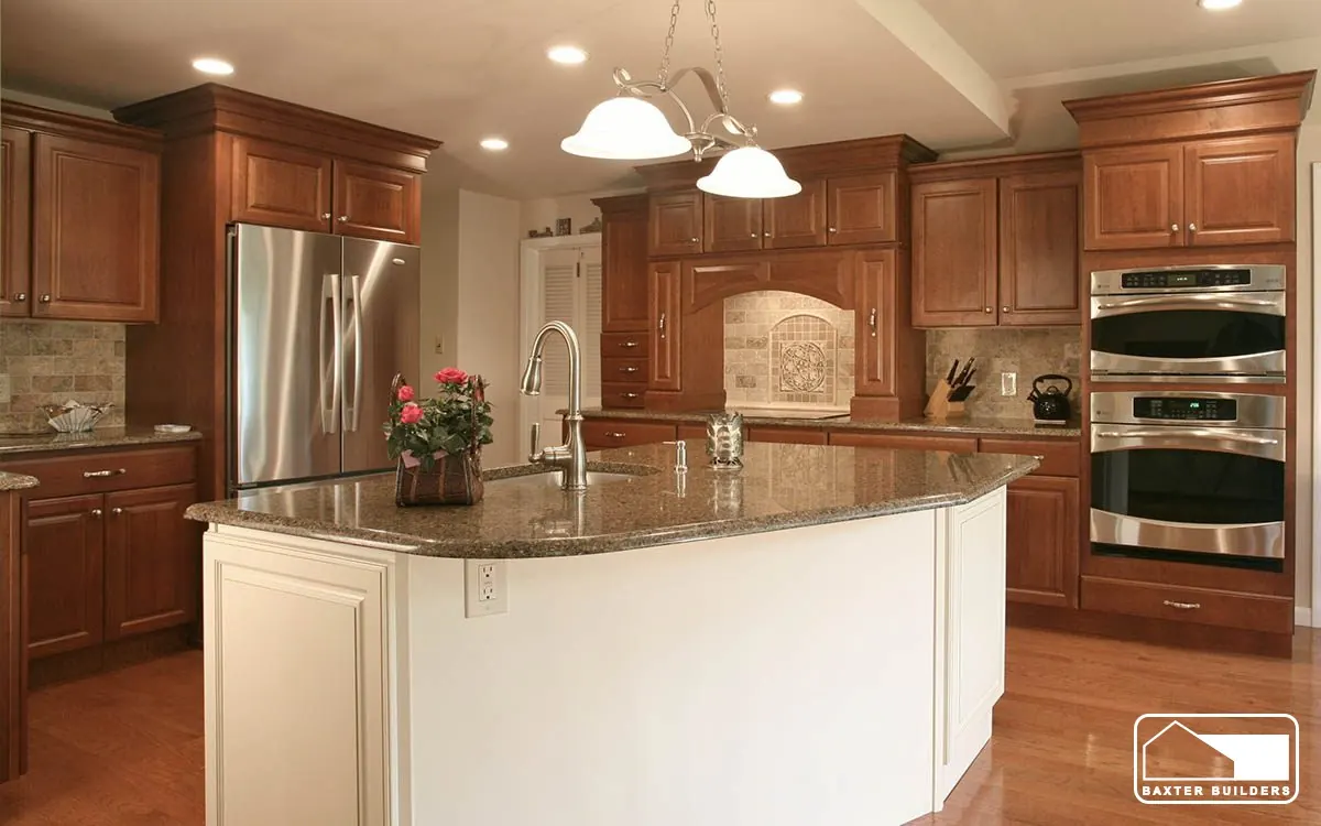 Cherry cabinet kitchen with large white island and granite counters